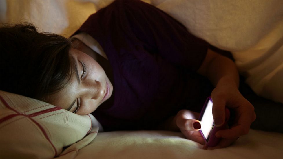 kids-sleeping-near-a-cell-phone