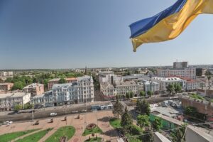 город