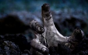 zombie-hand-rising-from-grave-wallpaper-532a71df170eb